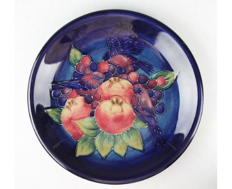 A Moorcroft Finches and Berries plate, 1990, painted 'WM' to underside, with painted and impressed marks to underside, 26cm d
