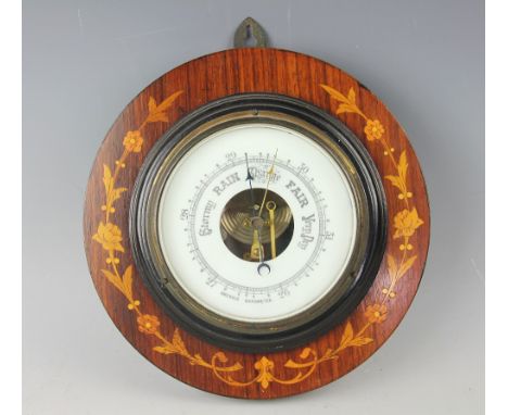 A late Victorian inlaid walnut aneroid barometer, 23.5cm diameter