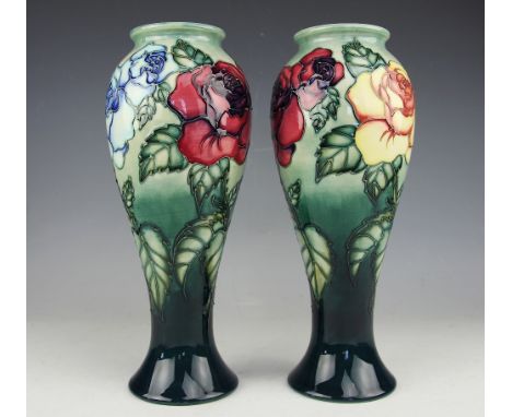 A pair of Moorcroft limited edition Rose pattern baluster vases, 1994, decorated in yellow, red and blue roses, No's. 475 and