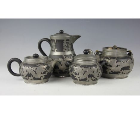 A late 19th/early 20th century century black Yixing and pewter mounted four piece tea service, comprising, a teapot and cover