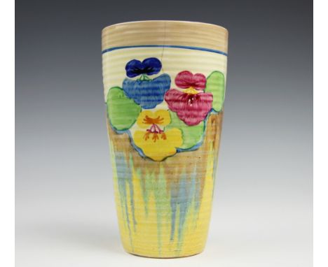 A Newport Pottery Clarice Cliff Bizarre, Pansy pattern vase, the tapering, ribbed vase decorated with brightly coloured flowe