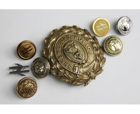 A white metal Shrewsbury Police badge, 7.5cm, with a button and five different buttons (7)