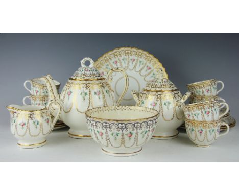 A 19th century tea service, each piece profusely decorated with  rose blossoms and gilt garlands throughout, comprising four 