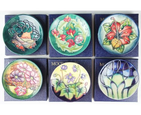 A collection of six Moorcroft pin dishes comprising; Mamoura 1993, Simeon 1999, Leicester 1995, Hepatica 1999, another exampl