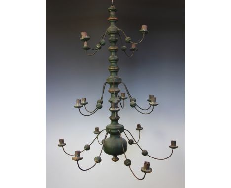 A Dutch turned and green painted wood twelve light chandelier, 77cm H
Lighting lots are sold as decorative items only.  Prosp