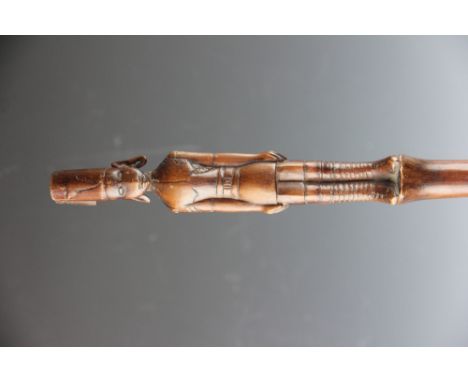 An East African tribal art Kamba Kenya carved wood staff, with Askari figure top, 119cm