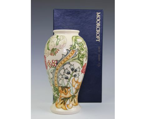A Moorcroft Golden Lily pattern vase, designed by Rachel Bishop, with scrolling blooms against an ivory ground, signed in gil