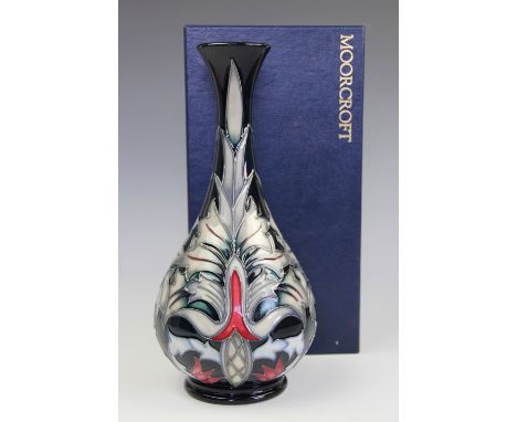 A Moorcroft Snakeshead pattern vase, designed by Rachel Bishop circa 1995, the William Morris inspired design against an ink 