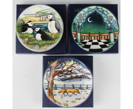 A collection of three Moorcroft pin dishes comprising; Jumeirah 1999, 11.7cm diameter, Puffins 1999, painted 'WM' to undersid