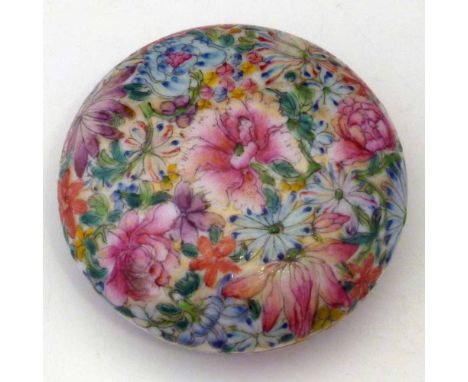 Chinese famille rose compressed globular box painted with flowers, red seal mark to base (rubbed), diameter 7.5cm. Condition 