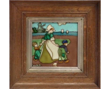 Frederick Rhead designed tile, tubed lined by Charlotte or Dollie with Dutch figures within a landscape, mounted within oak f