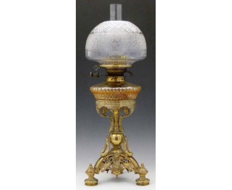 Cast brass table oil lamp and shade, the cut glass reservoir and brass frame in the form of a coronet, supported by acanthus 