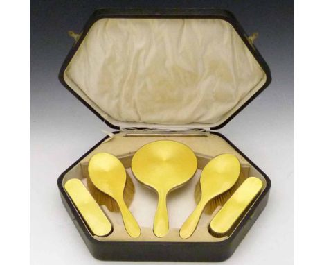 Six piece silver backed dressing table set decorated in yellow guilloche enamel, H.C. Davis, Birmingham 1925, of two pairs of