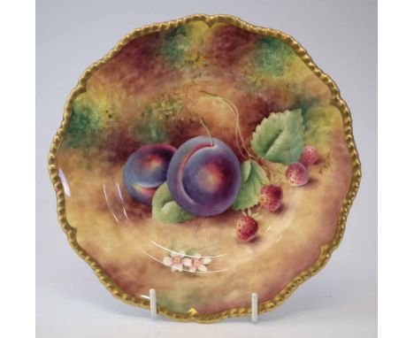 Royal Worcester plate signed T. Nutt,   painted with fallen fruit within a gadrooned gilt border, black printed marks to base