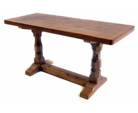 Robert (Mouseman) Thompson occasional table, rectangular top with adzed decoration on trestle two column base, 90cm (36") x 3