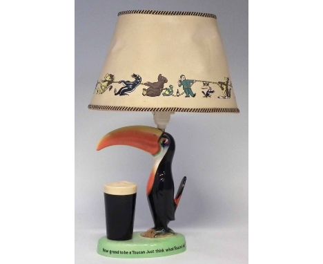 Carlton ware Guinness lamp base and shade, modelled with a Toucan with advertising verse printed around the base, printed mar