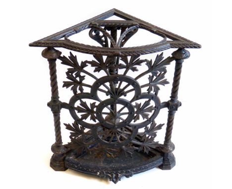 Late Victorian Arts & Crafts design cast iron corner walking cane stand, top frame supported by three rope twist columns flan