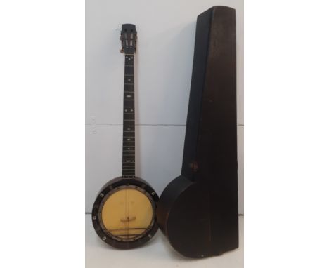 A late 19th Century banjo A/F having mother of pearl inlay and a black wooden case. Location:RWFCondition:Strings missing-if 