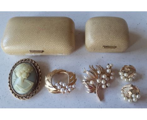 A vintage  Trifari gold tone and pearl brooch and matching clip-on earrings together with 2 other brooches. Location:If there