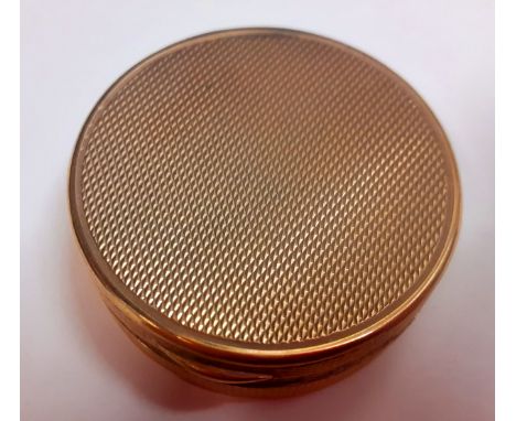 Asprey-A 9ct gold compact box having an engine turned lid with internal mirror, approx 3cm diameter, stamped Asprey to the in