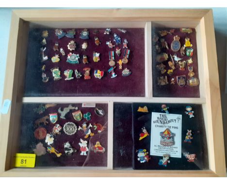 A collection of police charity and other charity pin badges to include Magic Roundabout tie pins, circa 1990's presented in a