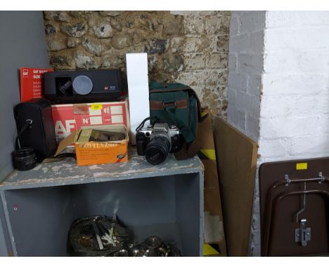 A selection of photographic equipment and accessories to include a Canon E05, 50E film camera and accessories, GAF 502 auto f