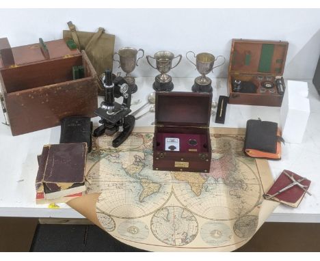 A mixed lot to include silver plated trophies, a vintage Cooke Troughton and Sons microscope and accessories, along with othe