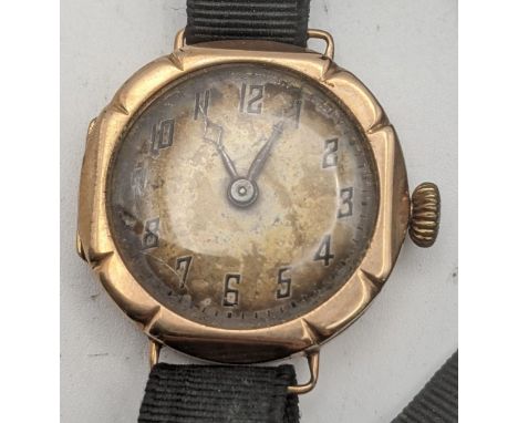 A 9ct gold ladies manual wind wrist watch on a black fabric strap, total weight 16.1gLocation CAB If there is no condition re