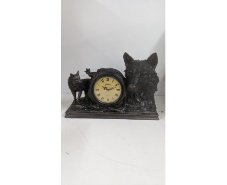 A Crosa resin mantle clock fashioned with a fox and foxes headLocation:If there is no condition report shown, please request