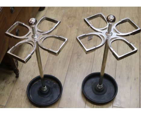 A pair of metal horseshoe shaped stick stands W.35cm