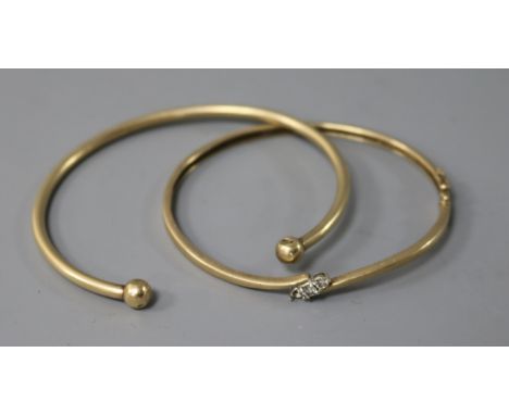 A diamond set 9ct gold hinged bangle ( one stone missing) and a yellow metal bangle, gross 19.7 grams.