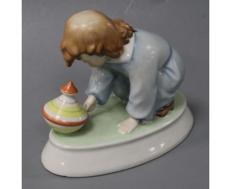 A Zsolnay ceramic model of a young child with a spinning top height 12cm