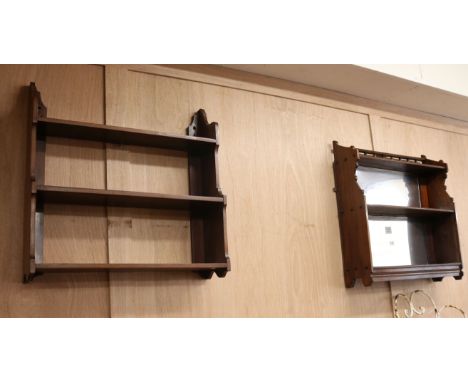 A mahogany three tier wall shelf and a mirrored wall shelf W.59cm