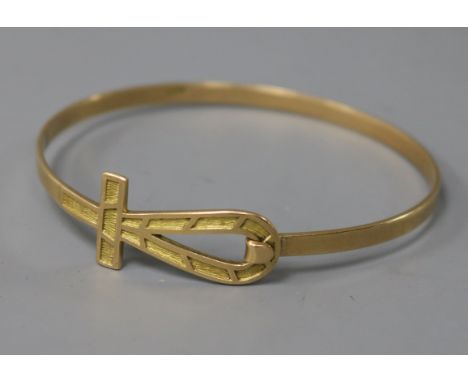 A Middle Eastern yellow metal bangle, 14.4 grams.