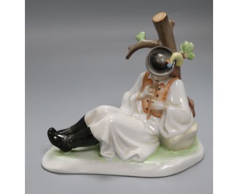 A Zsolnay ceramic model of a young piper boy by a tree height 19cm