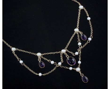 A Victorian style 9ct gold, cabochon amethyst and seed pearl drop necklace, 60cm.