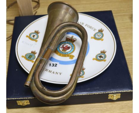 A Royal Airforce plate and a Saudi Air Force plate and a bugle