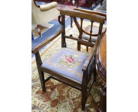 A set of five late George III mahogany dining chairs (one arm, for single), with floral tapestry seats