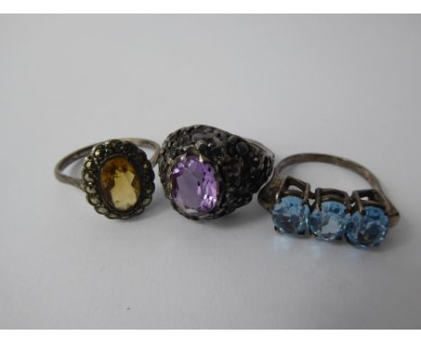 A Vintage Silver Citrine and Marcasite Ring, size Q, Citrine 10 x 6 mm, together with a silver and amethyst Baroque-style rin