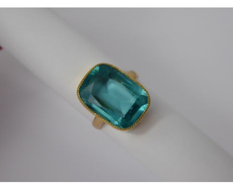 An Antique 18 ct Hallmarked Cushion Cut Aqua-Coloured Stone, mm PS, size R, the stone 18 x 12 mm, approx 5 gms.