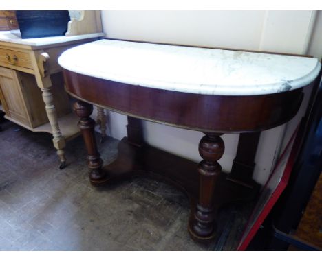 A Victorian Mahogany Duchess Dresser. The dresser having a white marble top, shelf beneath, approx 105 x 50 x 72 cms.