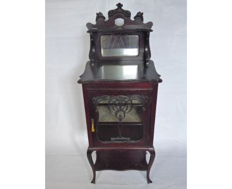 A Victorian Mahogany Mirrored Display Cabinet. The cabinet having galleried top with mirrored back, two shelves with glazed f