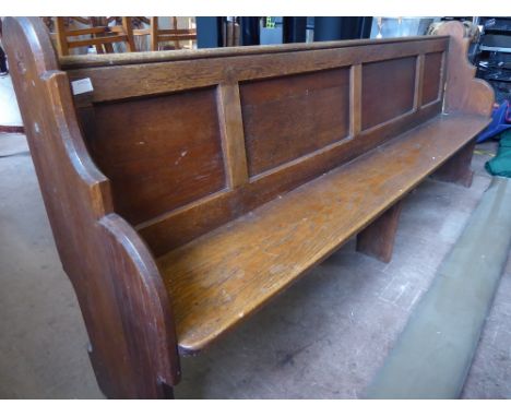 A Vintage Oak Church Pew. The pew having panelled back, approx 220 x 37 x 91 cms.