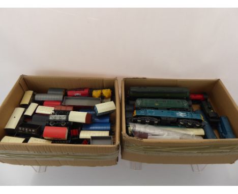 A Vintage Hornby 'OO' Gauge Railway Set, comprising a turn-table, transformer, platform boxes, a quantity of carriages, girde