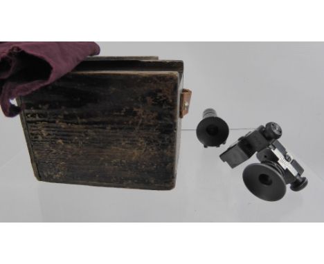 Two Vintage Service Rifle Aperture Sights, nr PH25, together with a tinted green lens nr PH7, in the original box. (2)