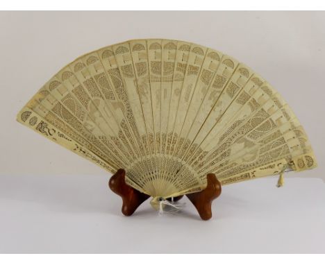 A Lady's 19th Century Delicate Ivory Brisé Fan, carved with classical figures to central cartouche, approx 31 x 18 cms (af)