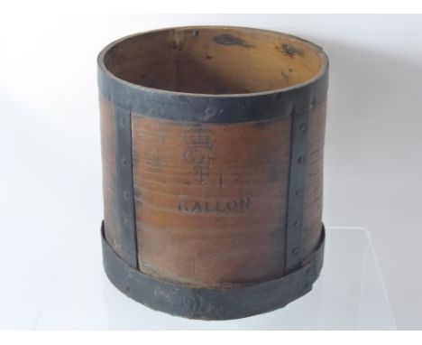 A Vintage One Gallon Wooden Drum Measure.