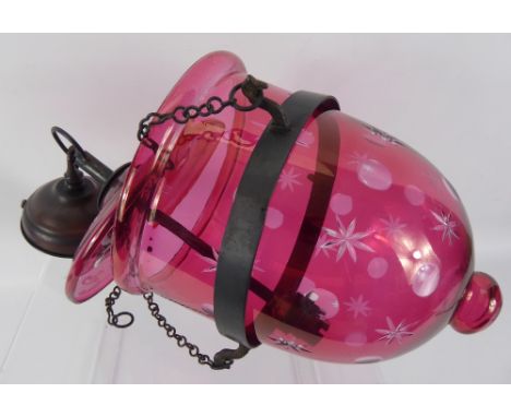 A Pair of Cranberry Glass Lantern Style Light Fittings, approx 24 x 47 x 19 cms.