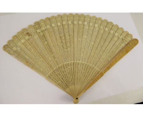 A Lady's 19th Century Ivory Delicate Brisé Fan, intricately carved with floral garlands, approx 25 sticks, with central shiel