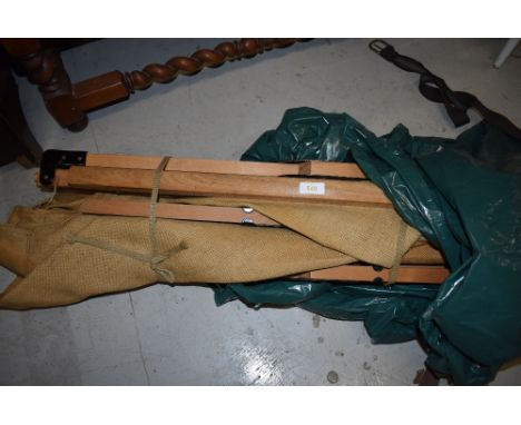 A vintage canvas military or military style camp bed